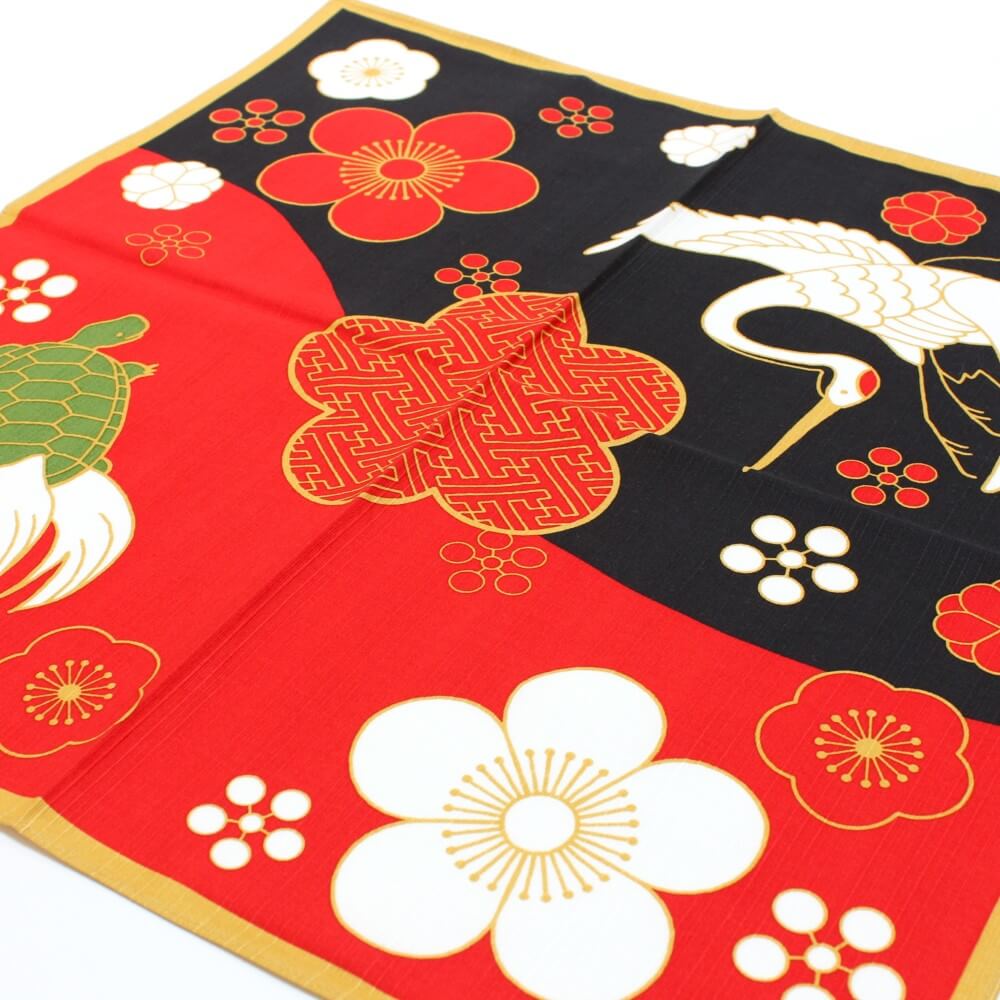 red and black furoshiki with crane and turtle and plum flower patterns