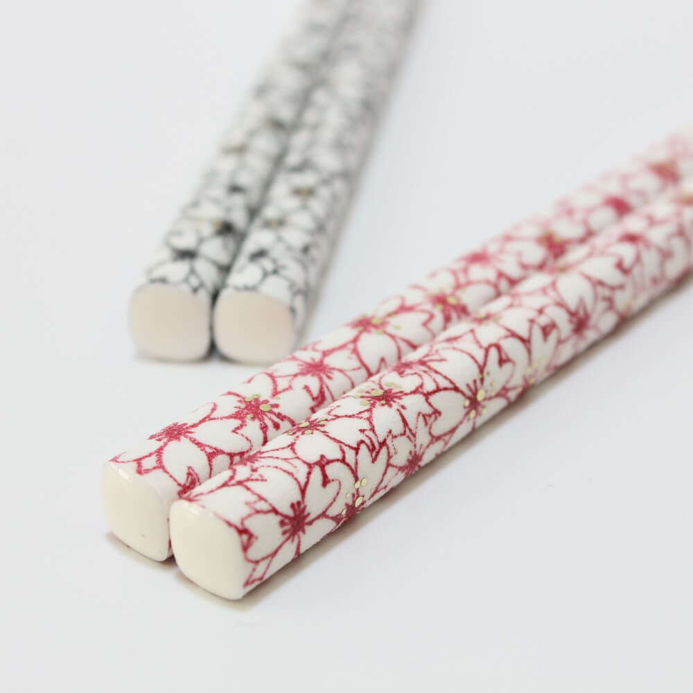 red modern sakura chopsticks handles close up