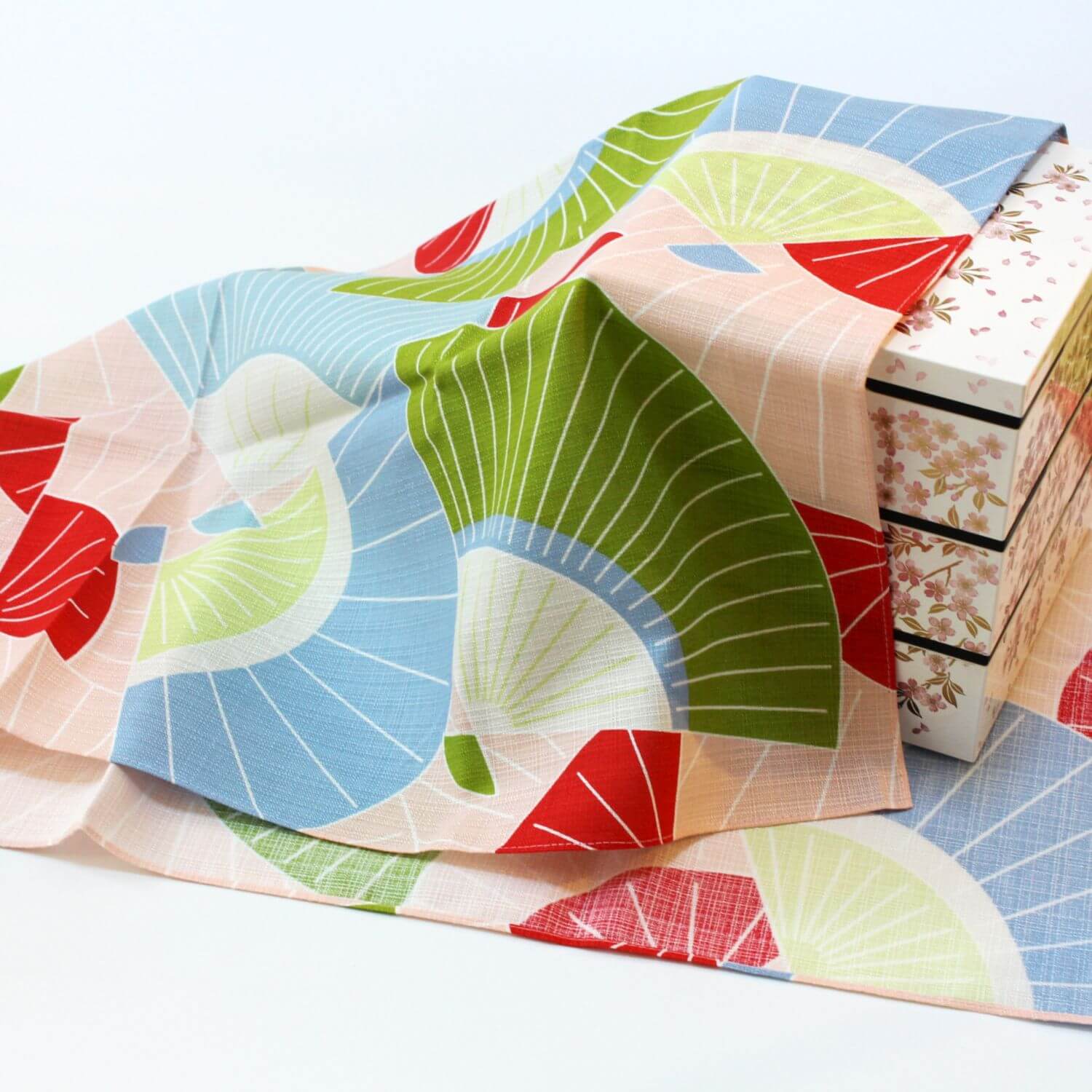 sensu japanese fans furoshiki covering a white jubako bento box