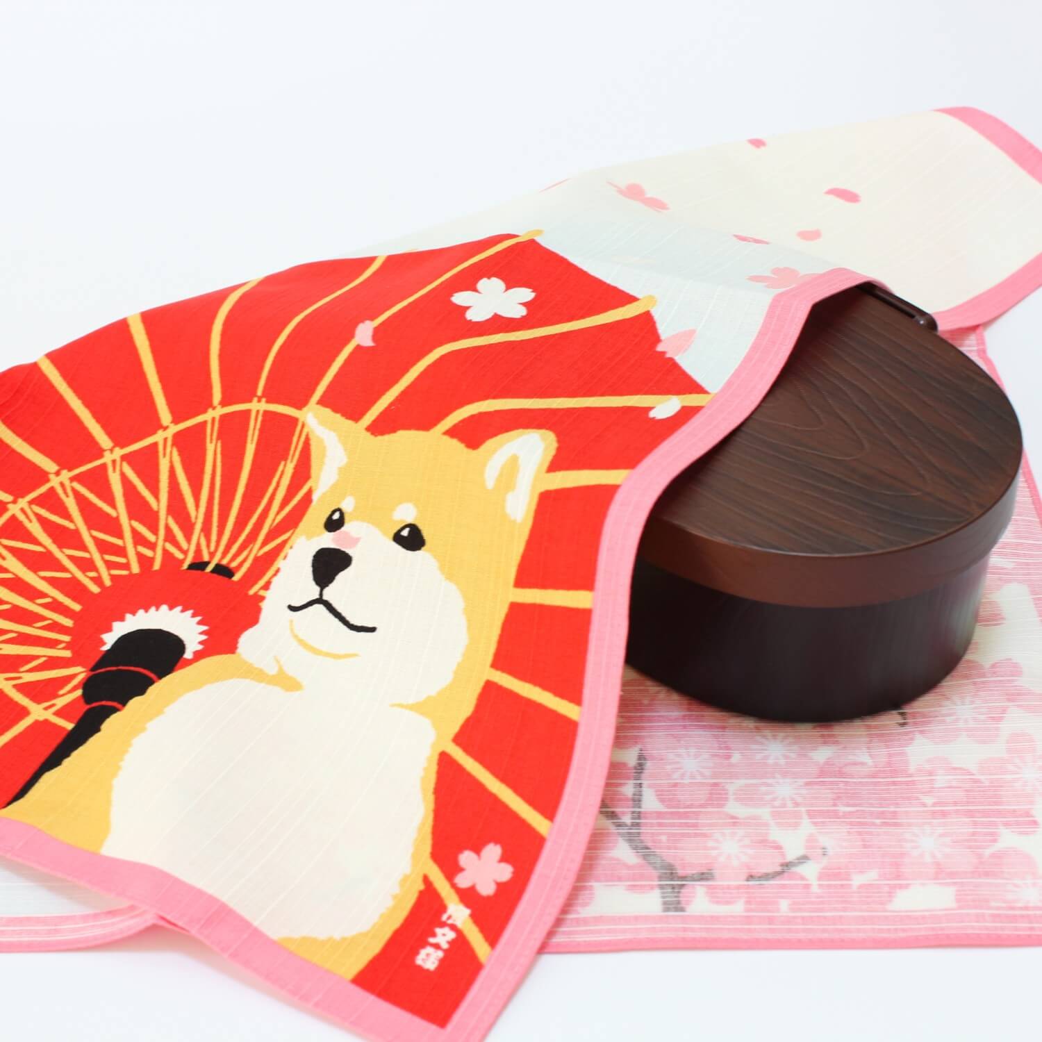 shiba sakura furoshiki covering a bento box