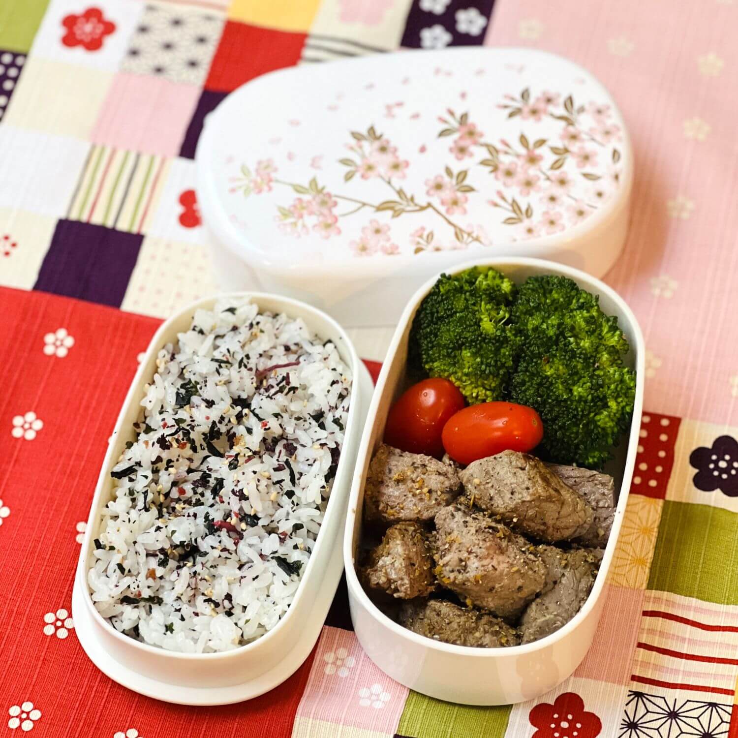 steak cubes bento in sakura white and pink oval bento box