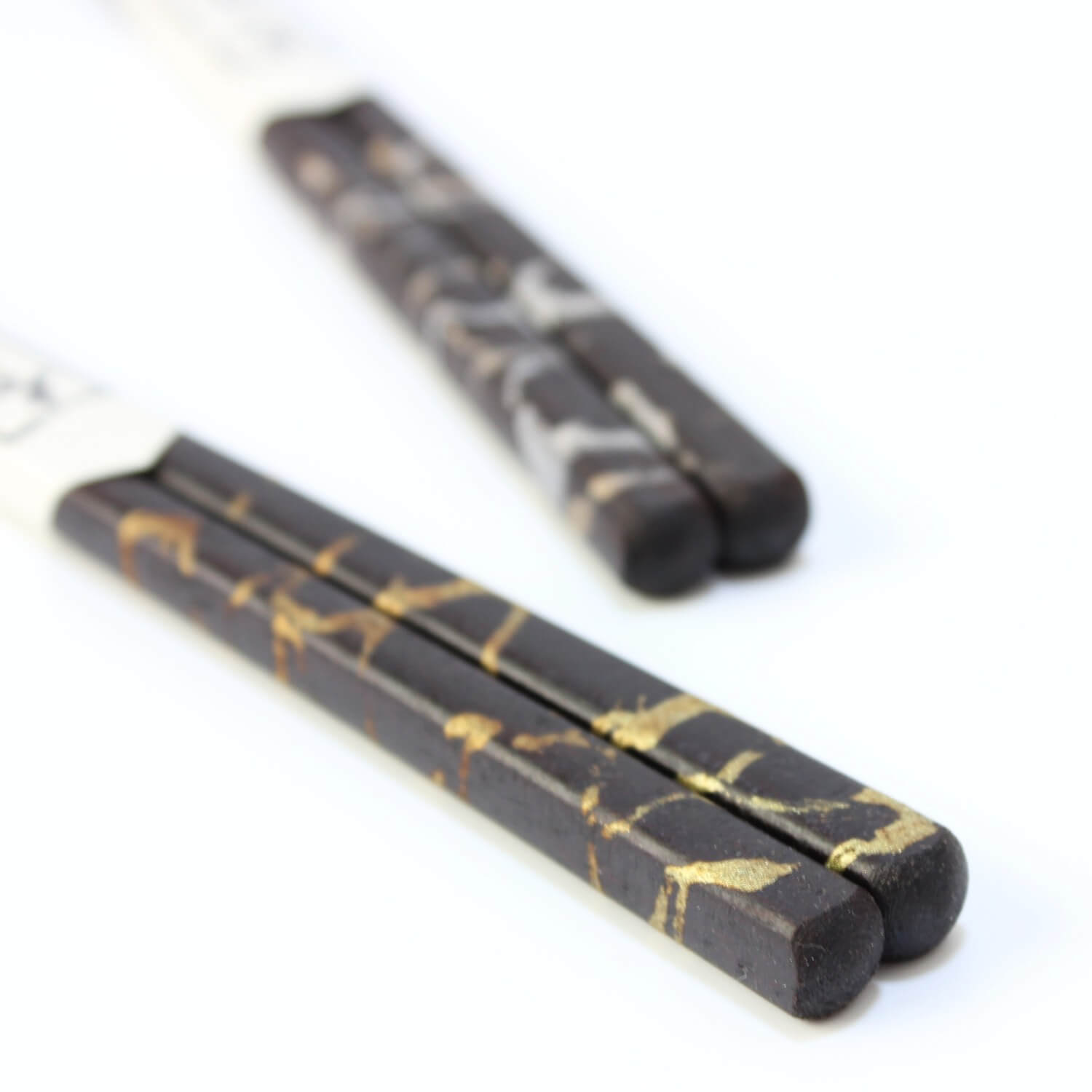 stylish shot of gold cloud chopsticks