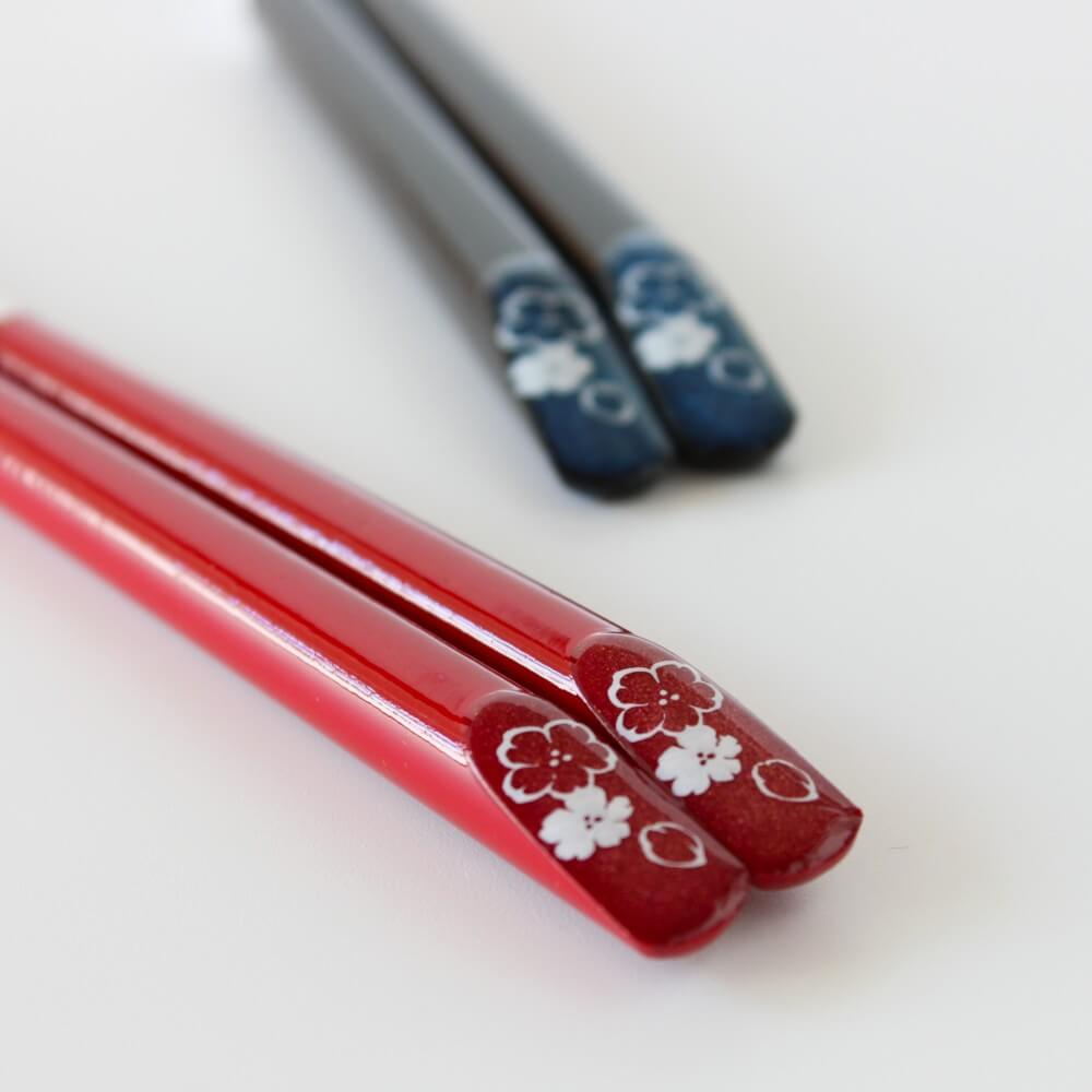 tensoge red cosmos red chopsticks in the foreground