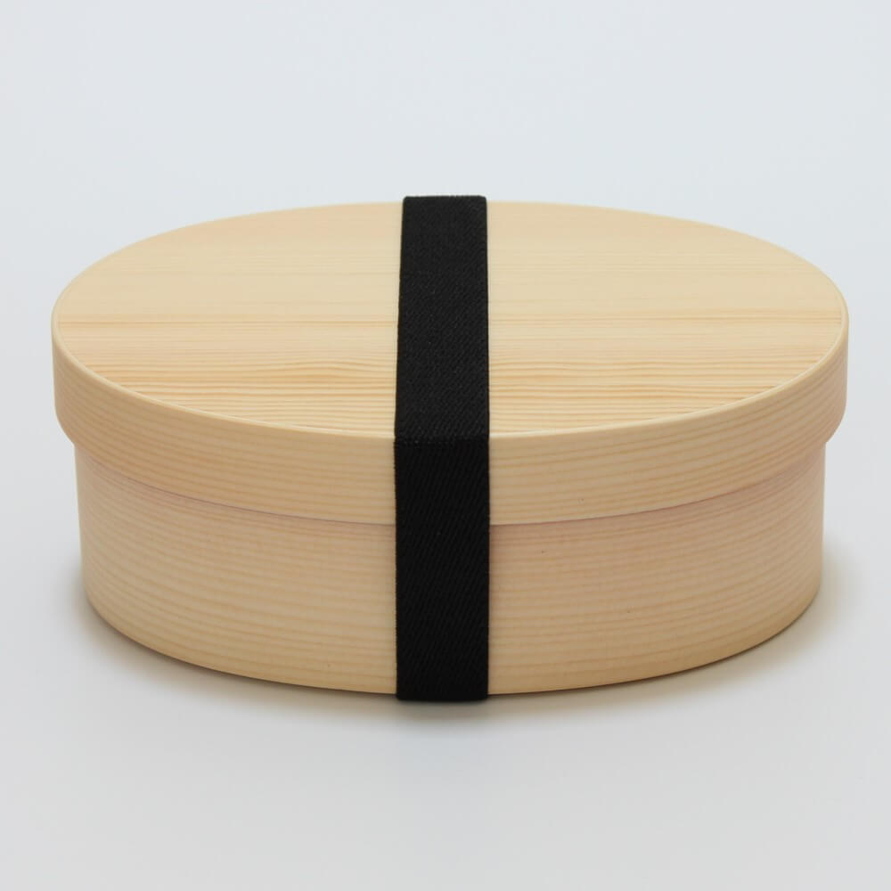 wooden magewappa bento box with black bento band securing the lid