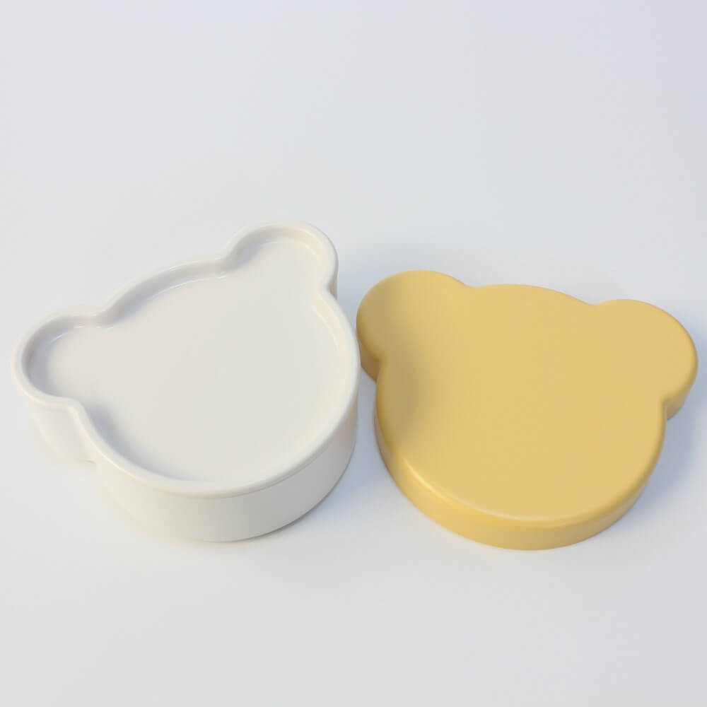 outer lid removed from base of the yellow KIDS DISH bento box from takenaka
