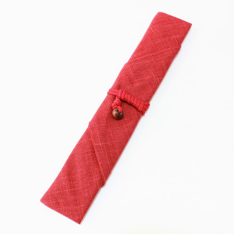 Overhead view of red fabric chopsticks case
