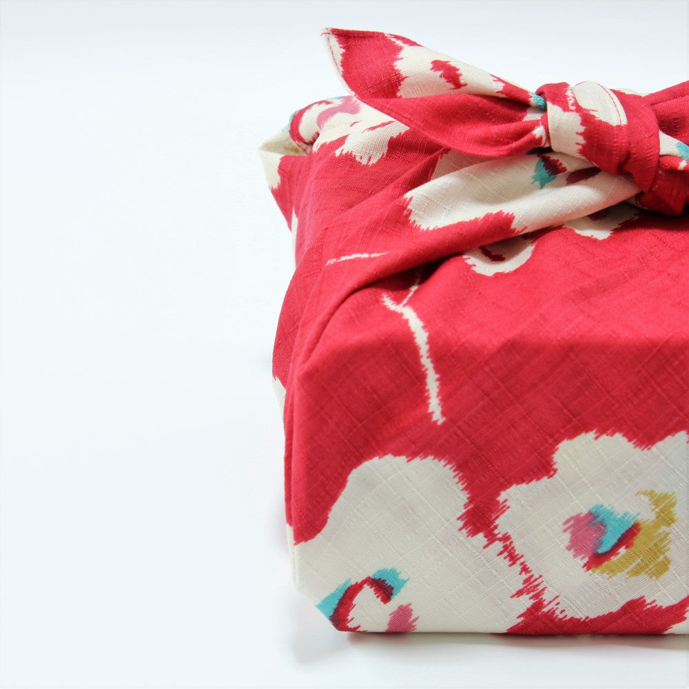 Side view of Modern Girl Plum Red Furoshiki Japanese Wrapping cloth showing white and blue flowers on a red background