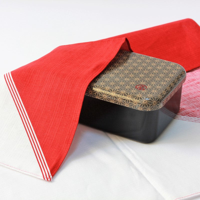 Red and White Furoshiki Japanese wrapping cloth over a bento box