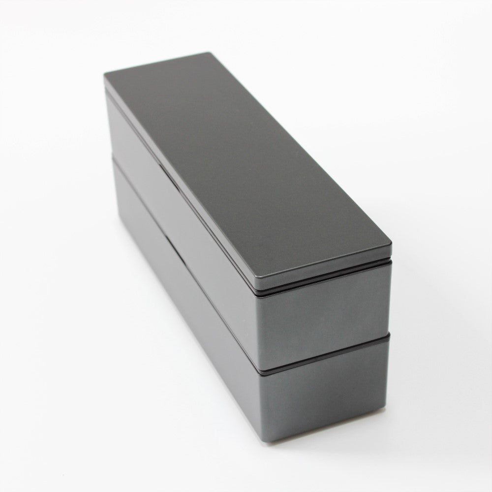 Two layered bento box long slim design with metallic black surface finish. Bento box from Japan