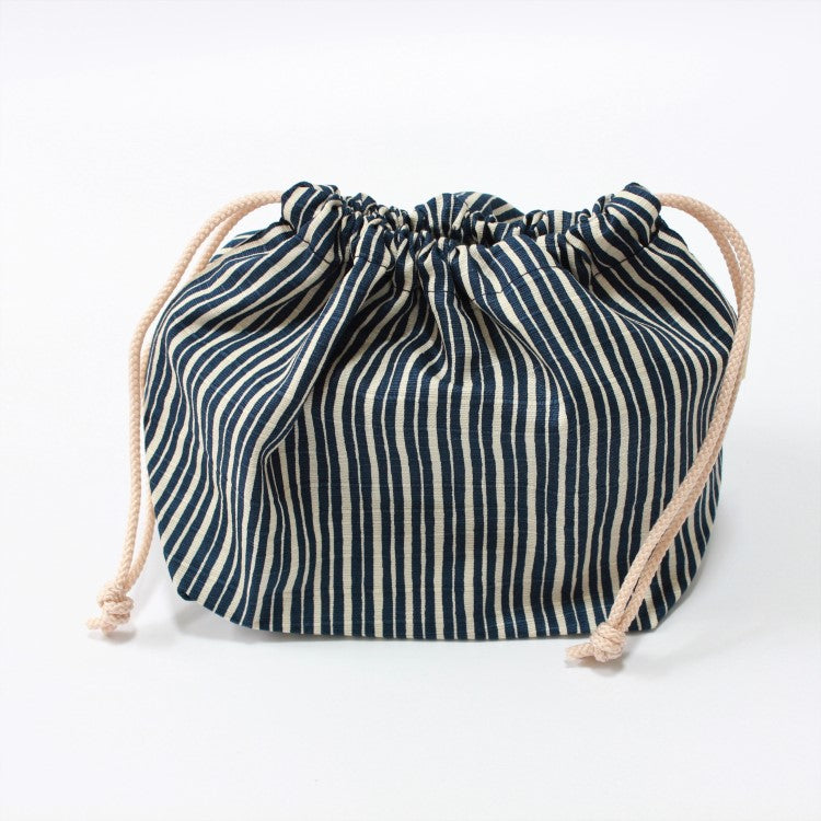 Side view of navy blue bento lunch bag 