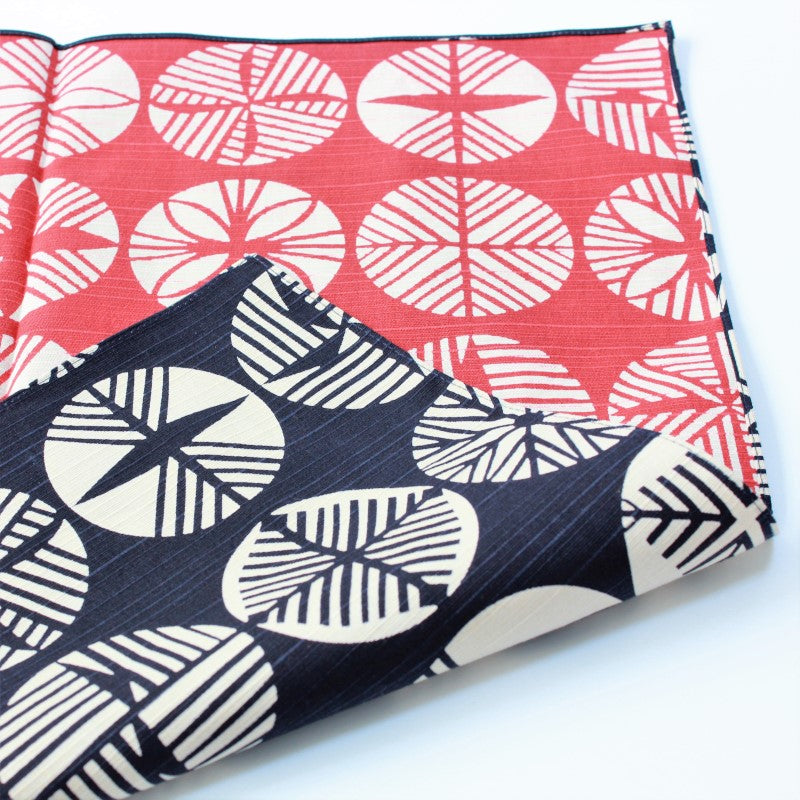 Isa Monyo Furoshiki laid out showing pine pattern on red and navy blue background, sold at Majime Life