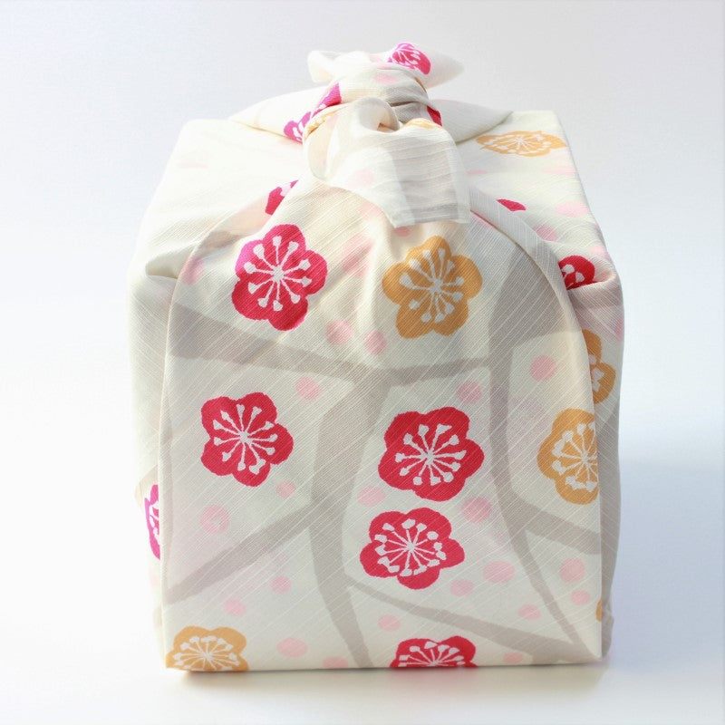 Side view of picnic bento box wrapped with yumeji takehisa furoshiki 