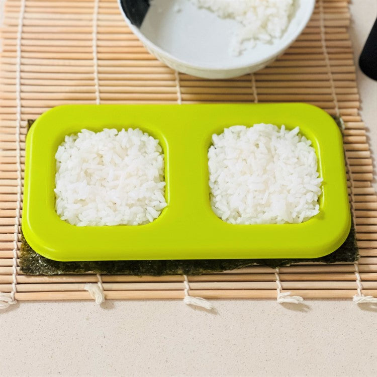 place mould on the seaweed, add rice into the mould