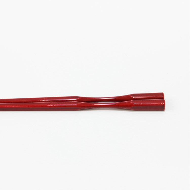 side view shot showing the curved neck of this tamari chopsticks. 