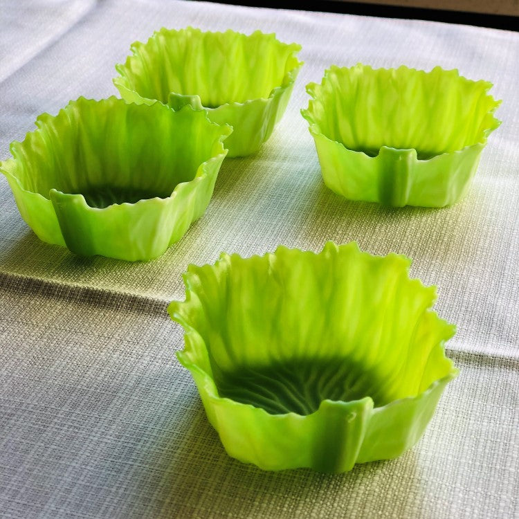 close up show showing 4 green lettuce divider cups