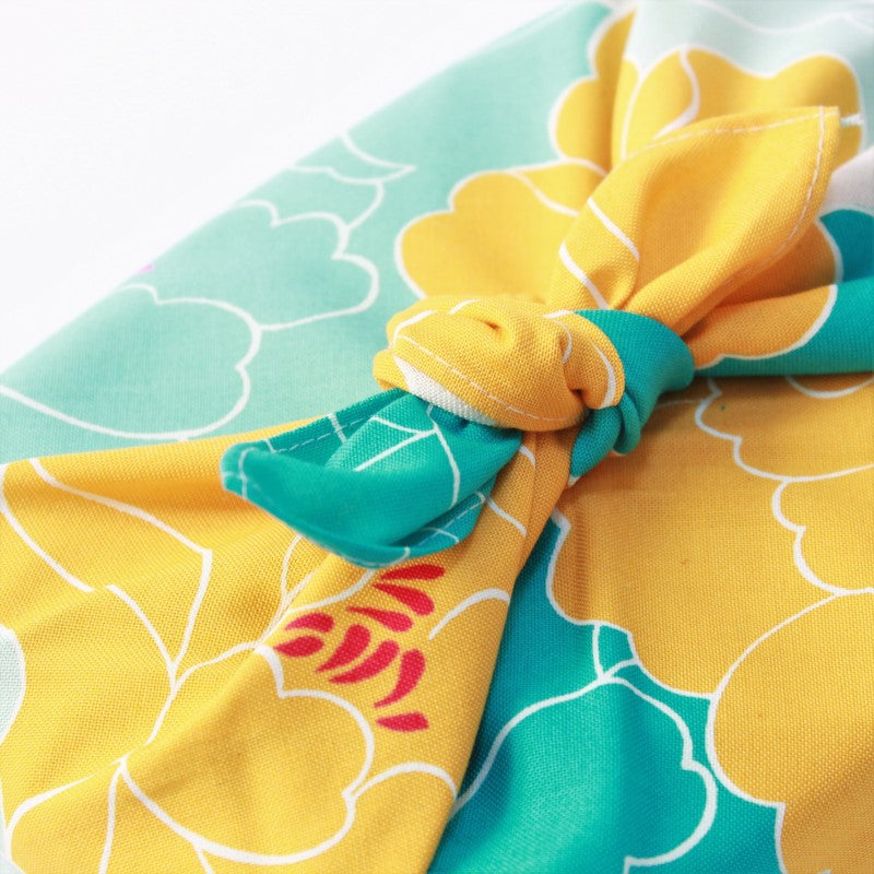 Close up shot showing the knot and fabric of the hime musubi peony blue furoshiki