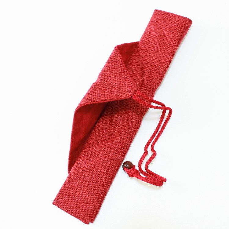 string undone on this red fabric chopsticks case