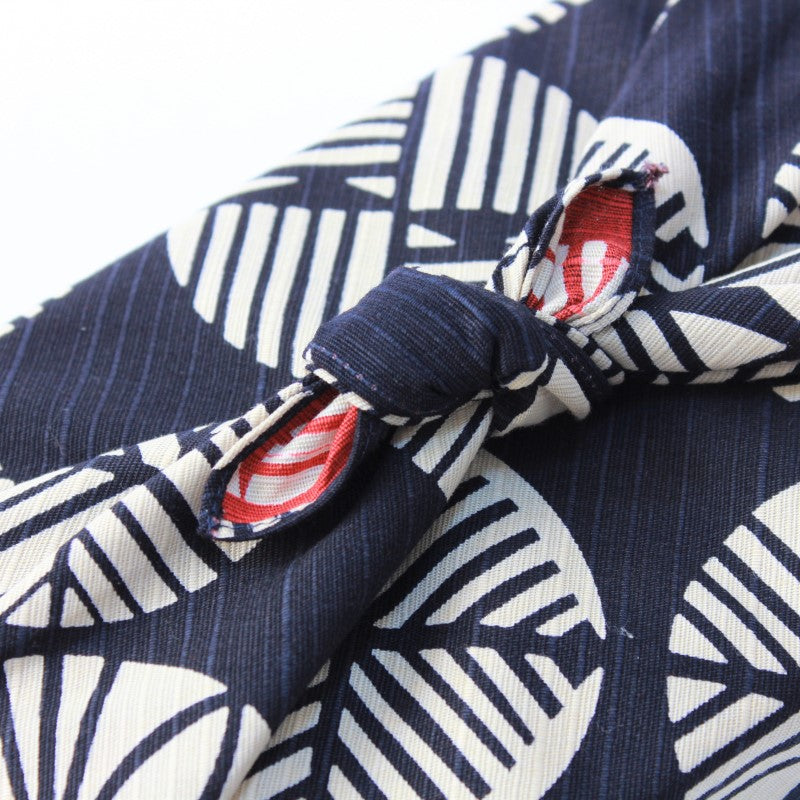 Close up shot showing the knot of the isa monyo pine navy blue and red furoshiki at Majime Life