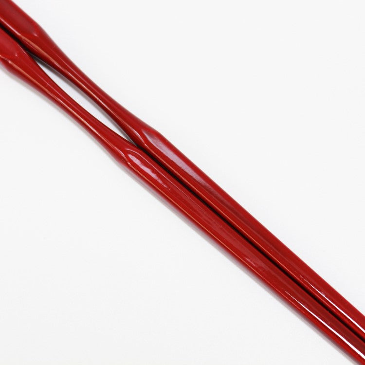 close up shot showing vermillion brown hue of this chopsticks