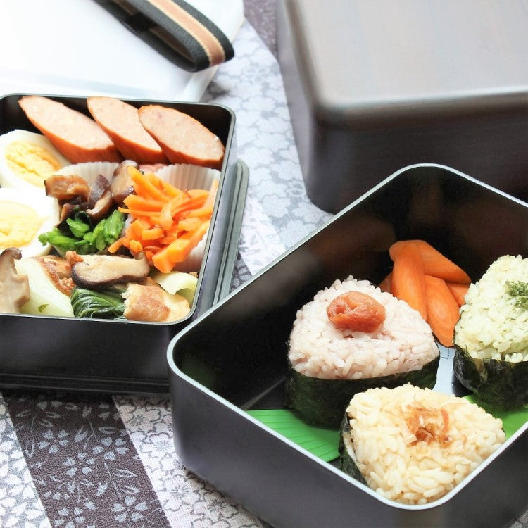 Photo of Japanese Onigiri Riceball and side dishes inside the benkei big bento box