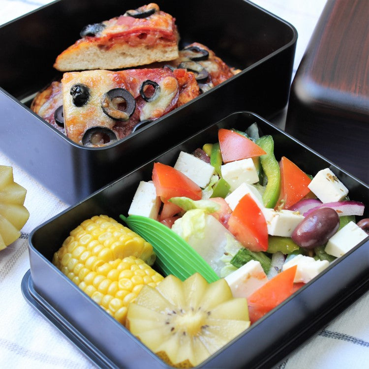 Pizza, salad, corn and kiwi inside the benkei big bento box