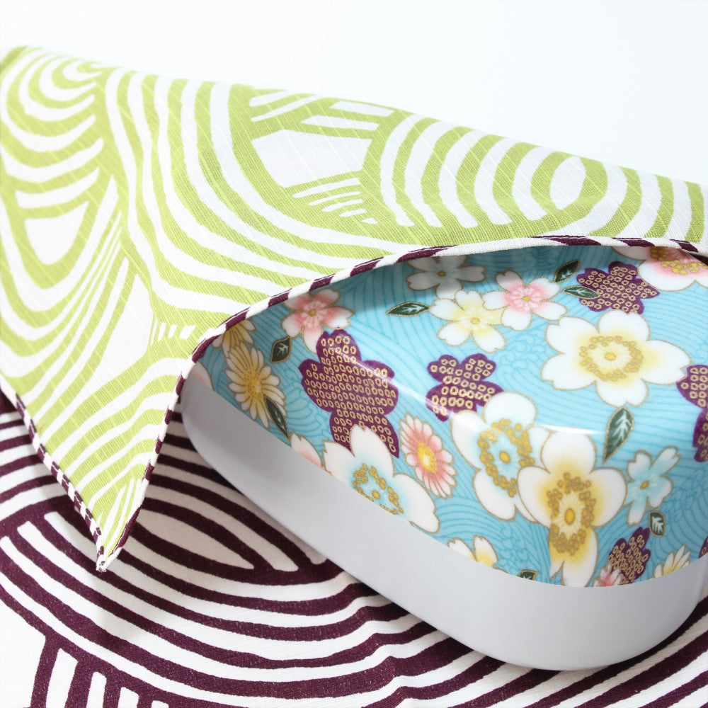 Isa Monyo Purple and Green furoshiki covering a kimono sakura blue bento box from Majime Life.