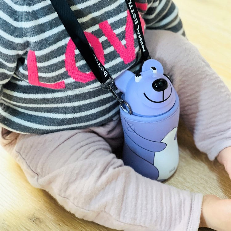 child sitting with the pale violet themo mug animal bear bottle