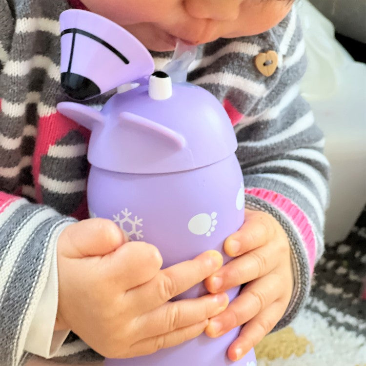 child drinking from the bear animal drink bottle