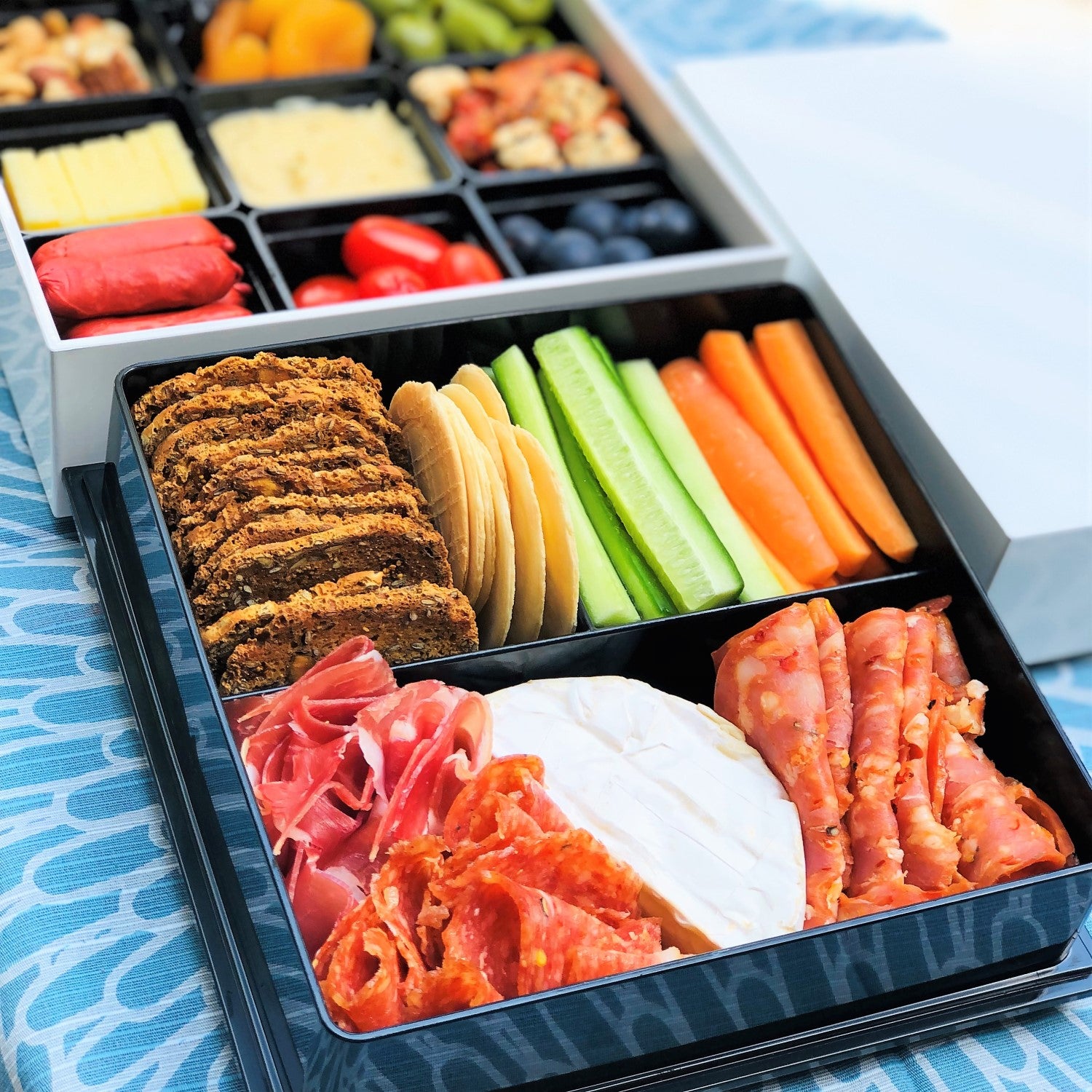 Shirayuki Picnic bento box holding finger and party food in the bottom and top layers