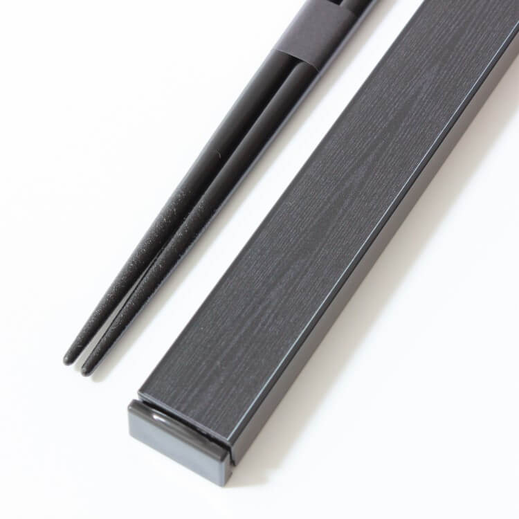 close up shot showing woodgrain aesthetic of chopsticks case