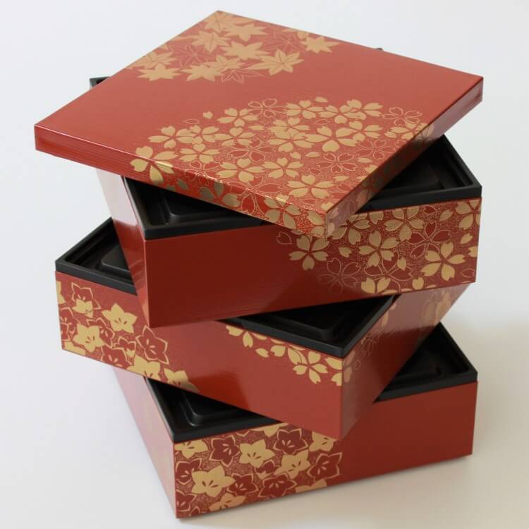 stacked spirally arranged layers of hanamaru vermillion picnic bento box