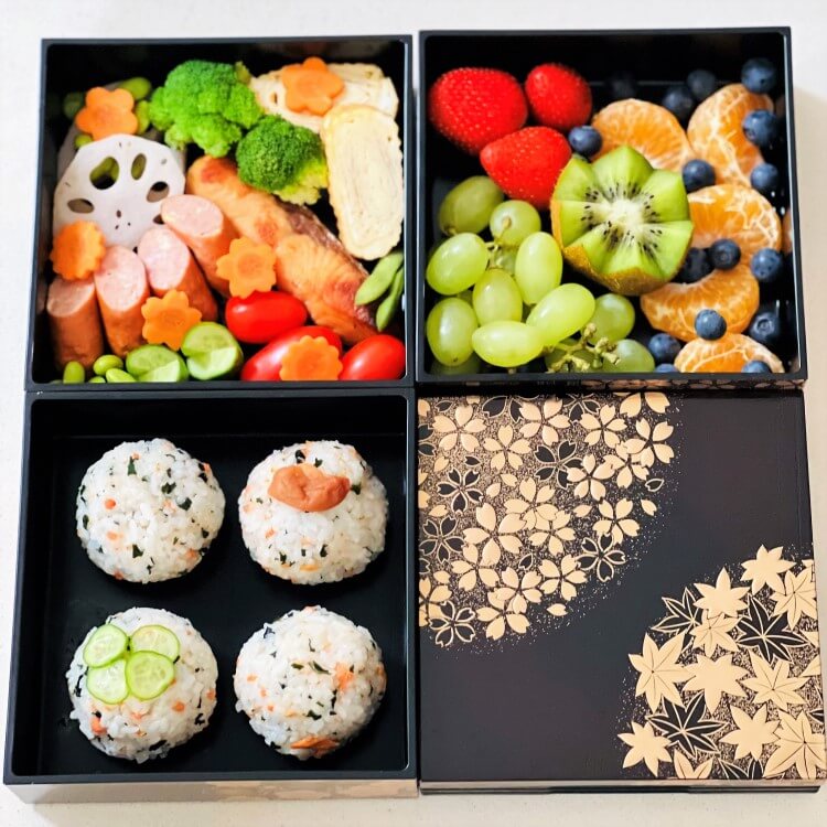 overhead shot showing 3 compartments with food picnic bento box