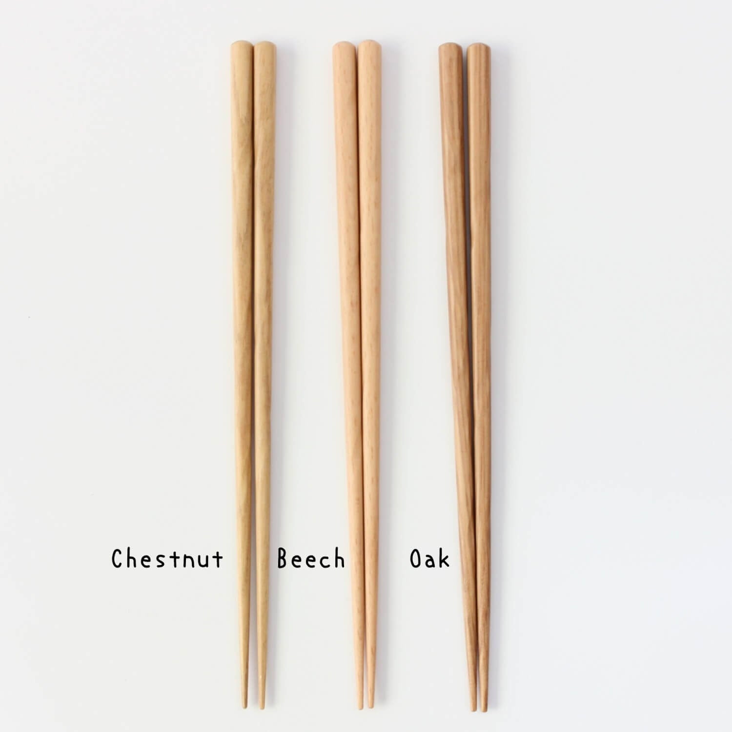 Three pairs of wooden chopsticks in full length labeled 'Chestnut', 'Beech', and 'Oak'.