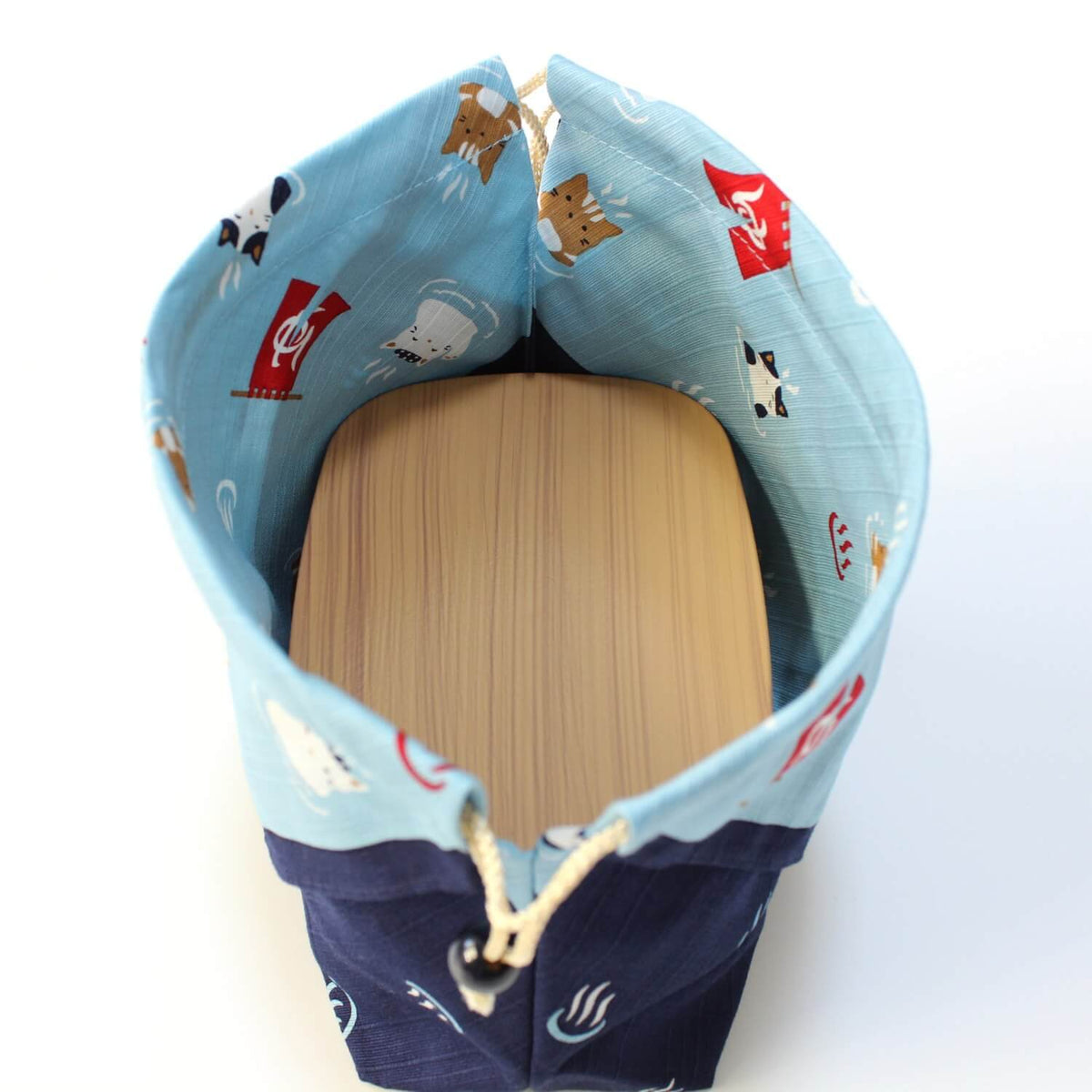 brown bento box inside kinchaku drawstring bento lunch bag
