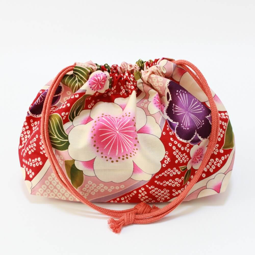 bento box inside sakura blossoms lunch bag