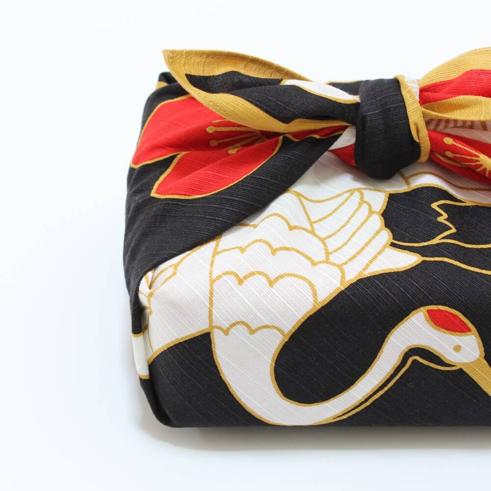 bento box wrapped in hama monyo furoshiki crane pattern