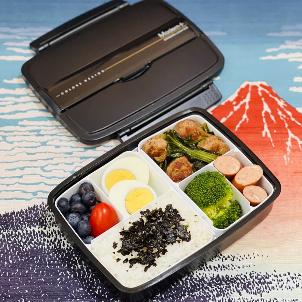 bento with multiple side dishes in modern plus bento box