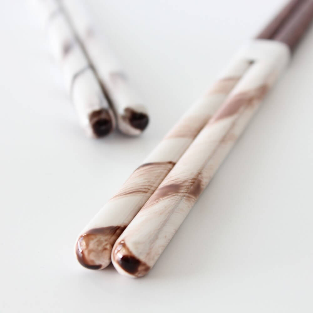 brown rucola chopsticks in foreground