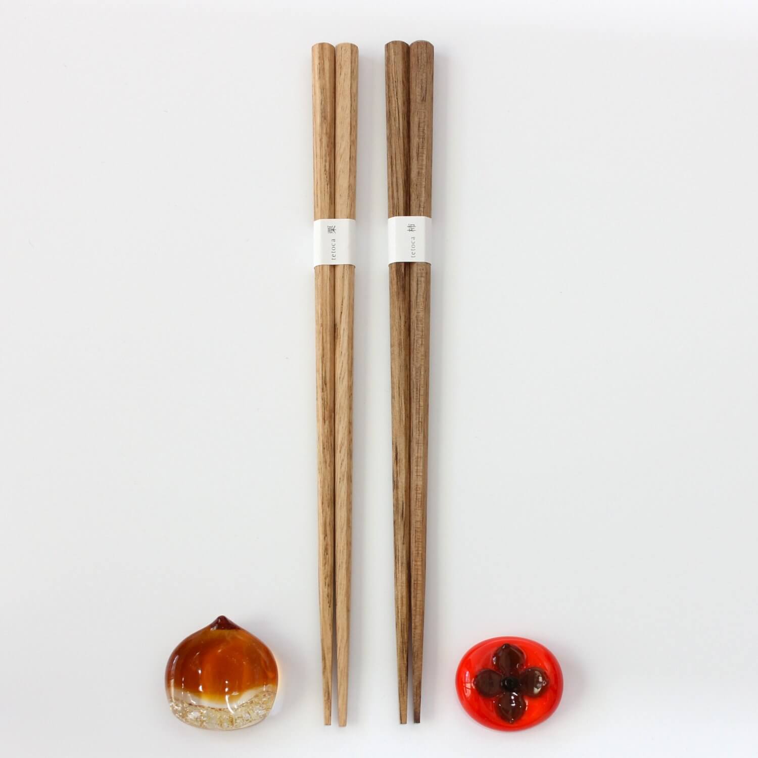 chestnut persimmon wood chopsticks with rests by their side