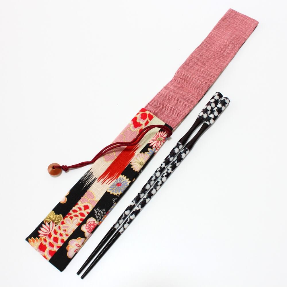 black and white chopsticks beside wagara black fabric case