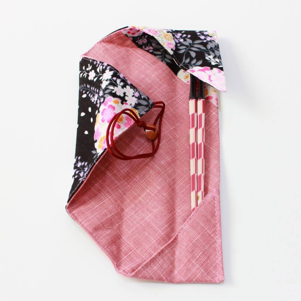 chopsticks in fabric case half closed