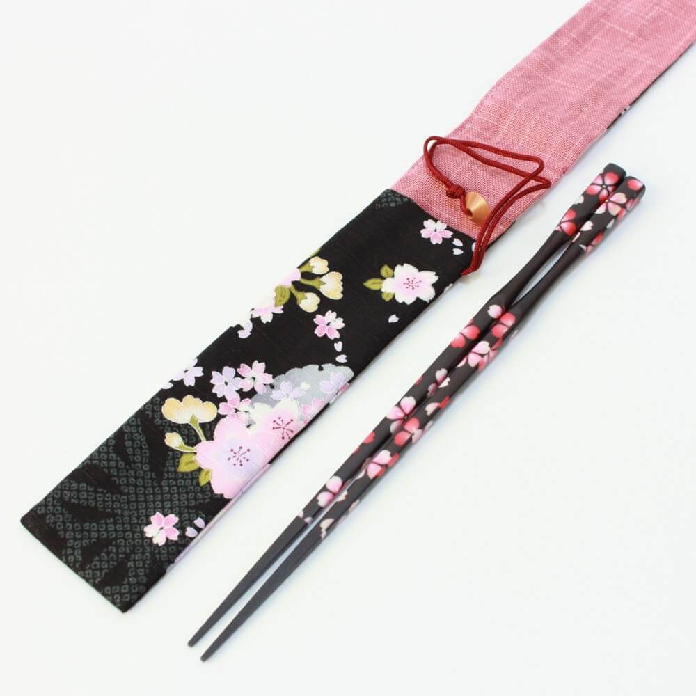 chopsticks next to sakura black chopsticks case