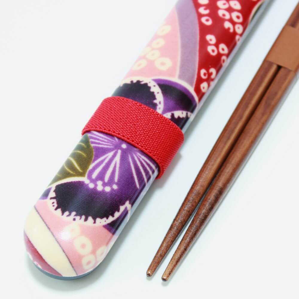 close up chopsticks case and tips sakura blossoms