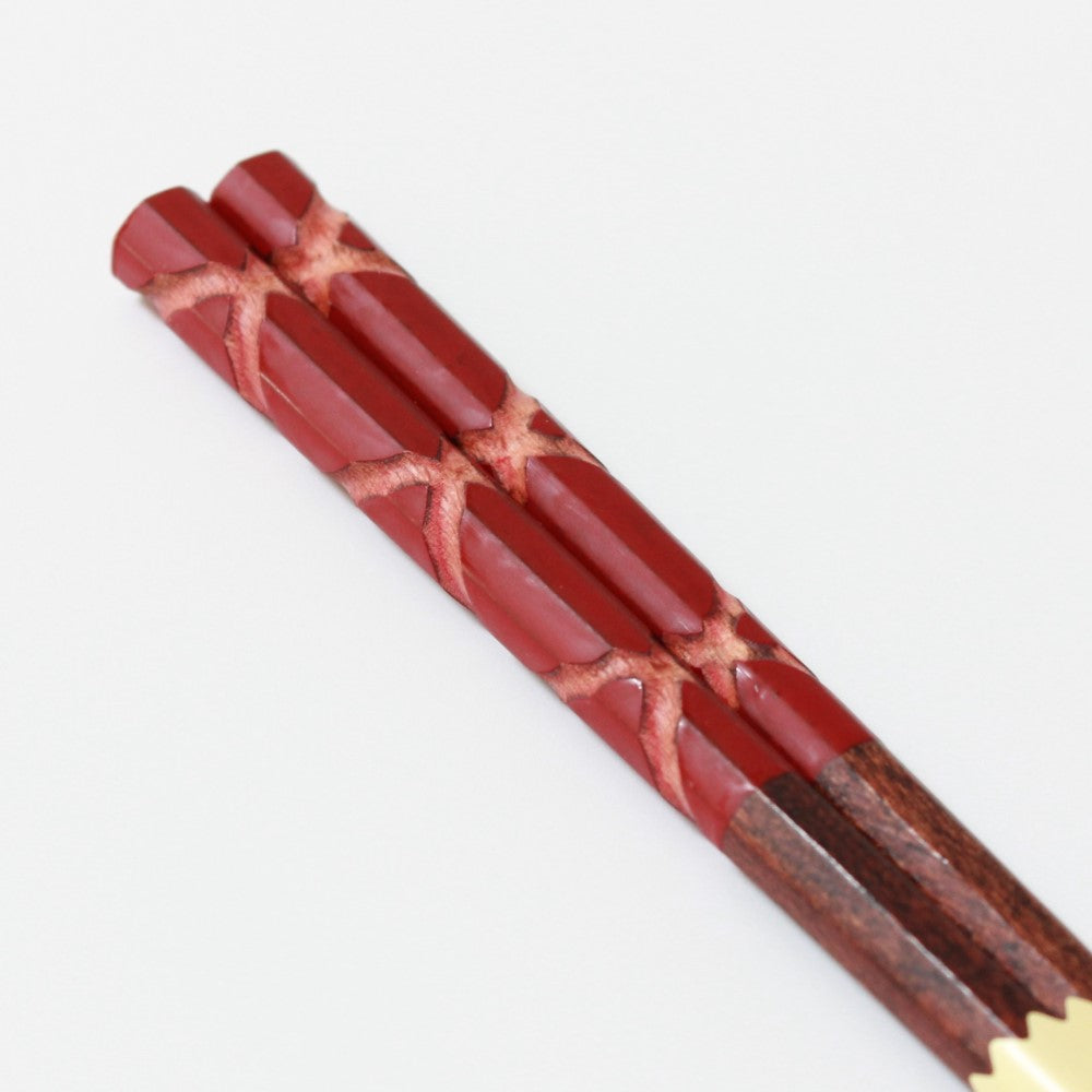 close up handles hachikaku red chopsticks