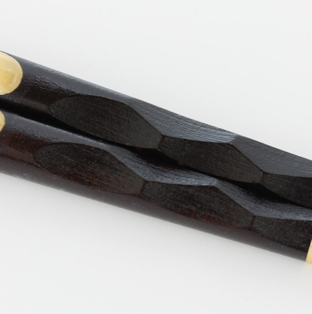 close up of carved chandles tenpyo tiger chopsticks