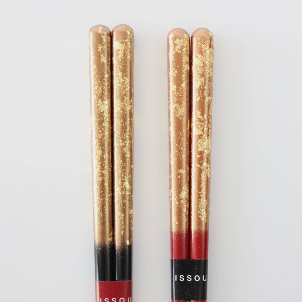 close up handles zuiun chopsticks showing gold leaf coat