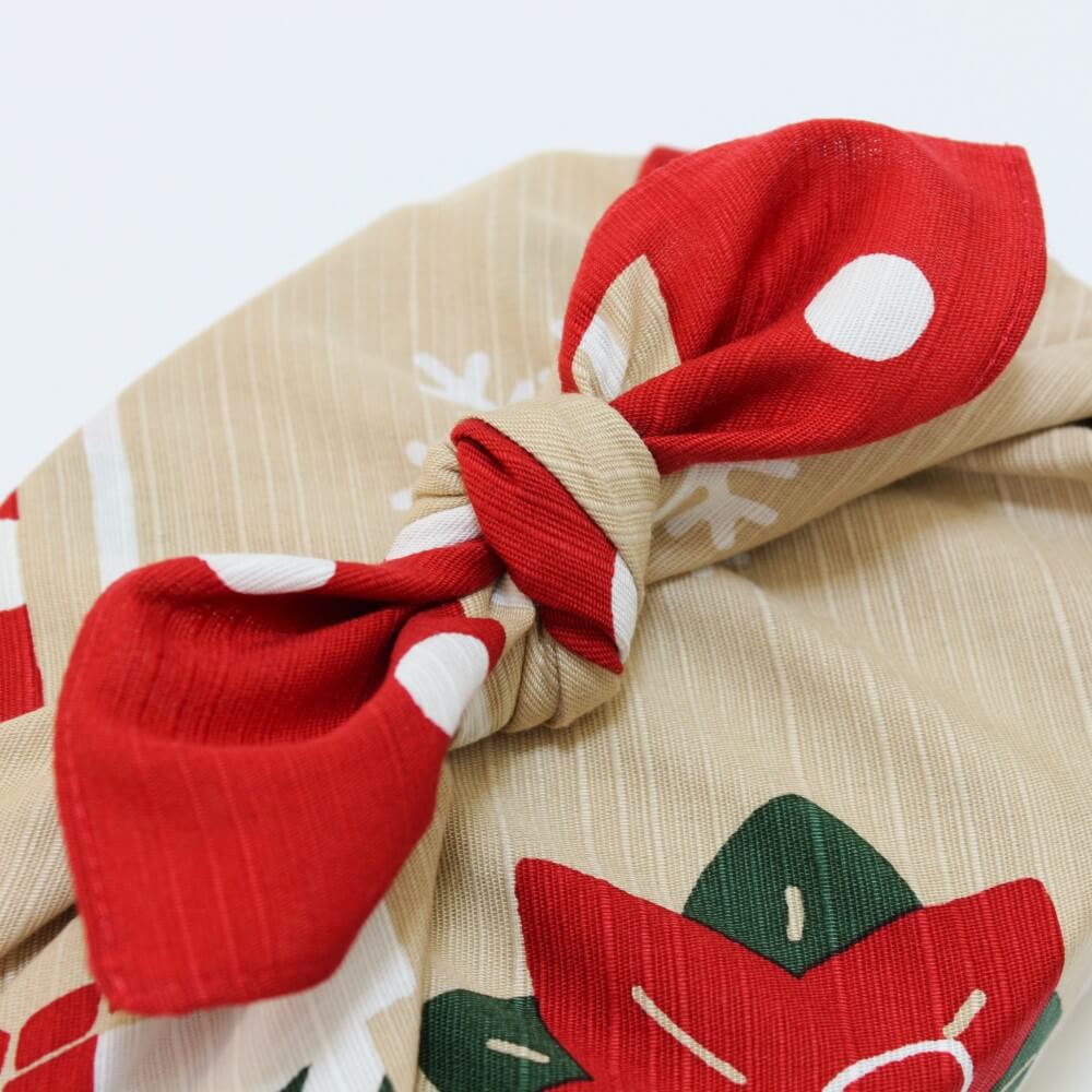 close up of knot wrapped christmas furoshiki