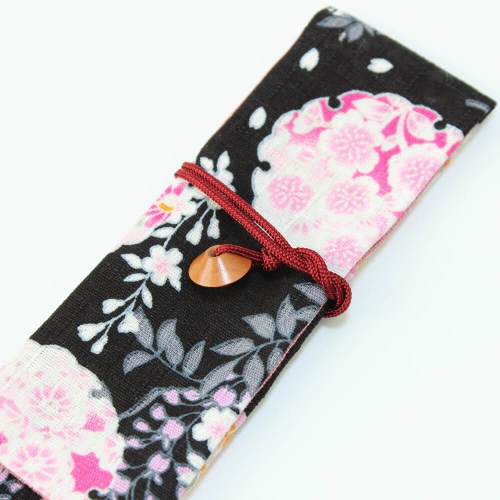 close up string tie fabric chopsticks wrap