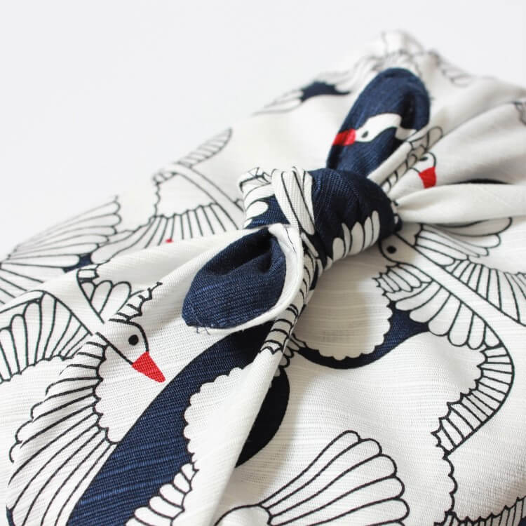 close up tied knot celebration crane navy furoshiki