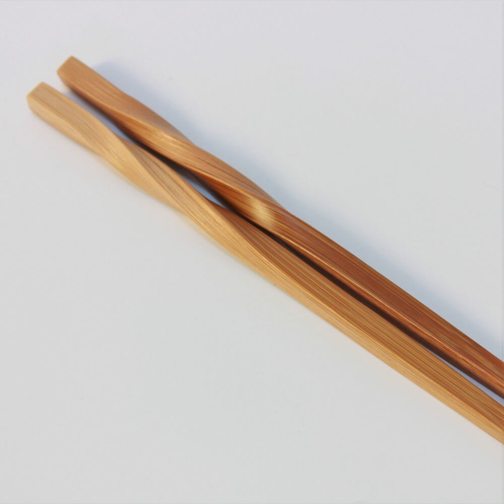 close up twisted neck japanese bamboo chopsticks